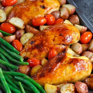 One Pan Baked Chicken With Potatoes, Green Beans and Cherry Tomatoes - Tender and juicy chicken breasts baked with vegetables in a sheet pan. A quick and healthy dinner that's super easy to make. It takes only about 30 minutes. Quick and Easy Dinner, healthy, Sheet Pan recipe.