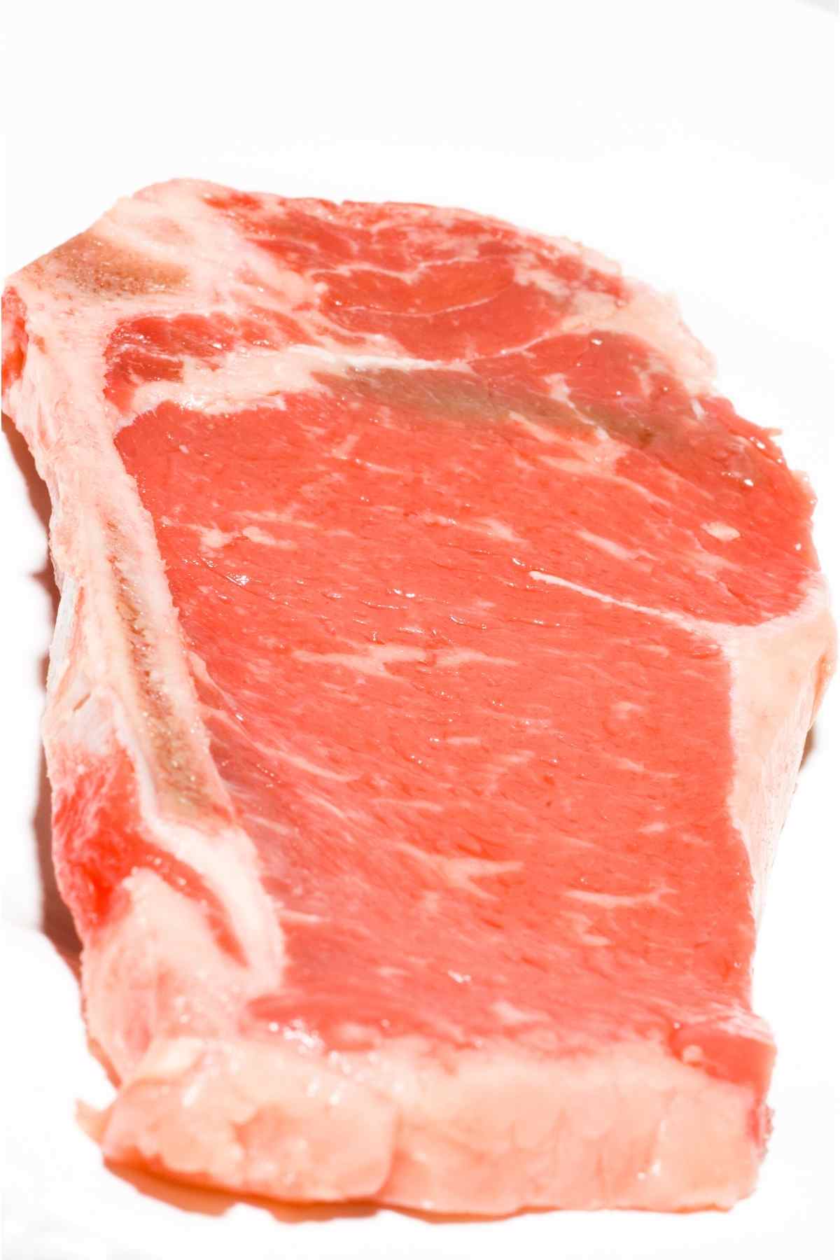 A raw shell steak showing the shell bone