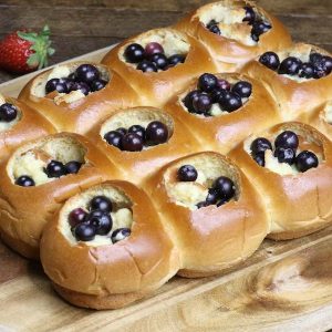 Blueberry Cheesecake Bread Pudding Pull Aparts – Soft and fluffy dinner rolls or Hawaiian sweet rolls filled with delectable blueberry cheesecake. The easiest and best bread pudding that can be pulled apart! Only 7 simple ingredients needed for this delicious treat: Dinner rolls, blueberry, cream cheese, sugar, egg, vanilla extract and milk. Serve warm out of the oven for breakfast, brunch or dessert. So good! Quick and easy, party food, party dessert. Great for Mother’s Day Brunch. Video recipe. | Tipbuzz.com