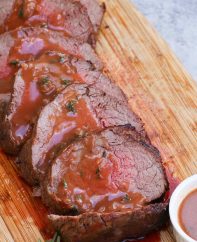 Slices of chateaubriand cooked medium and drizzled with chateaubriand