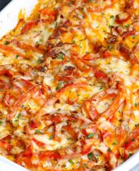 A chicken fajita casserole fresh out of the oven with melty cheese