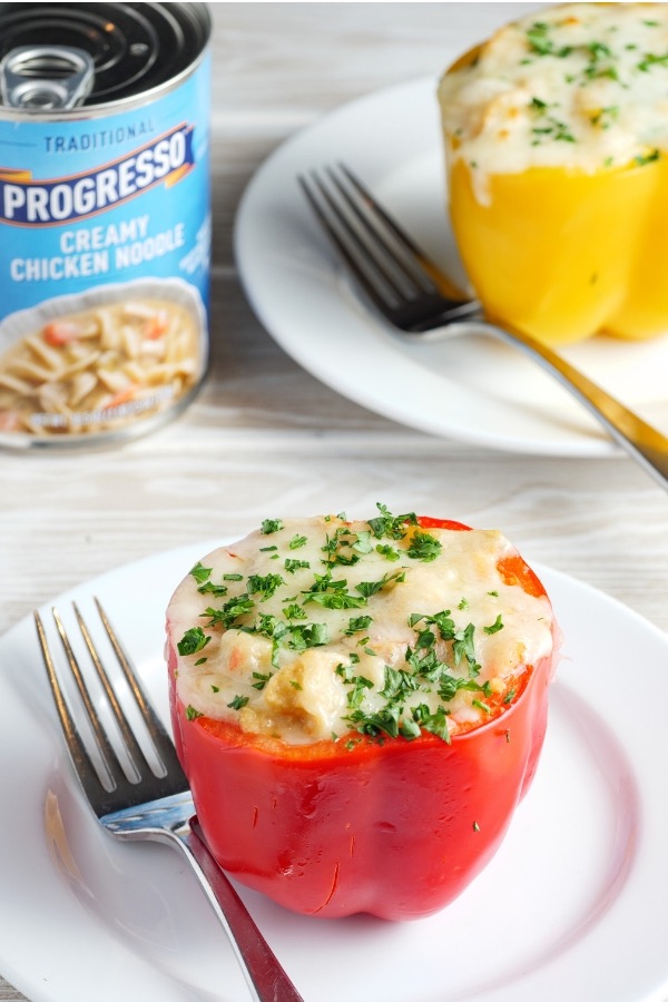 Closeup of a stuffed red bell pepper on a plate after being baked to golden perfection for a delicious side dish