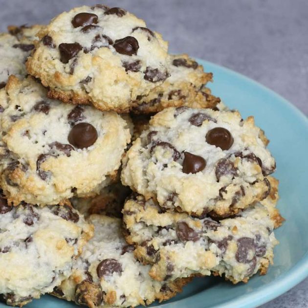 Warm Almond Joy Cookies stacked into a pyramid on a serving plate