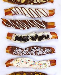 Chocolate covered bacon made six different ways including with dark chocolate, white chocolate, nuts and sprinkles
