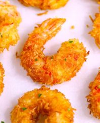 These Coconut Shrimp make an irresistible appetizer that's tender on the inside, and crispy, sweet and crunchy on the outside. They're mouthwateringly delicious and will be the first to go at a party! Plus recipe video tutorial!