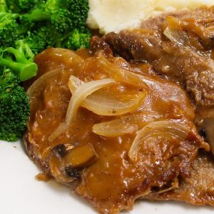 Crock Pot Cube Steak and Gravy made with tender and succulent cubed steak smothered in a rich and divine mushroom sauce in a slow cooker.