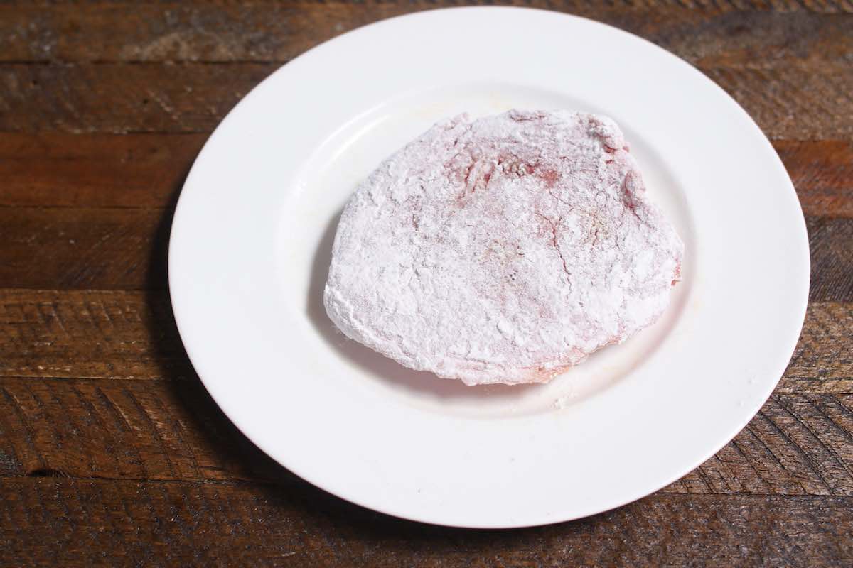 Dust eye of round steaks with flour.