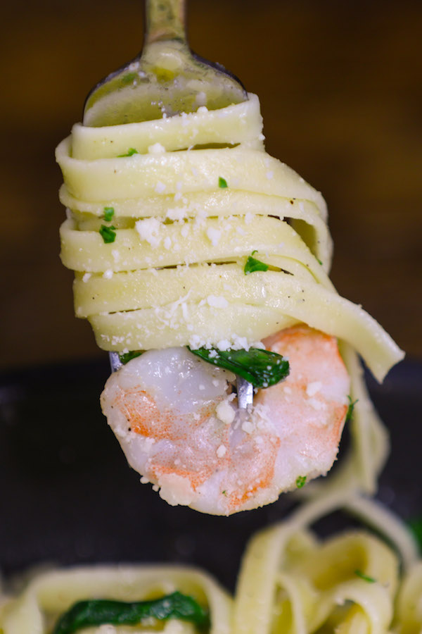 Tender and juicy shrimp are cooked in a garlicky and buttery sauce before being tossed with baby spinach and freshly grated parmesan.