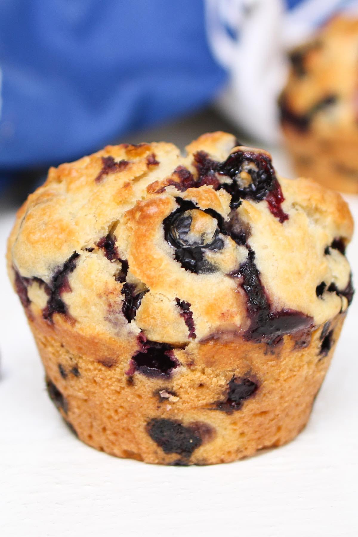 Closeup of delicious healthy muffins right after baking, showing the golden tops with fresh berries