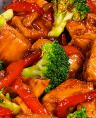 This chicken stir fry recipe features tender chunks of chicken with garlic, broccoli and bell pepper in a sweet and savory sauce, for a weeknight dinner that's easy to make in 20 minutes