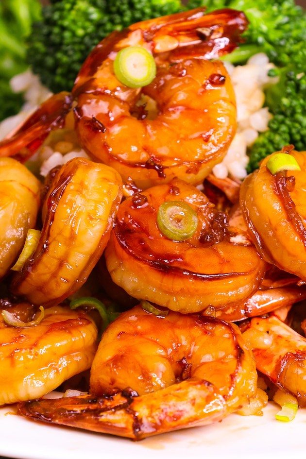 Sticky and Easy Honey Garlic Shrimp is a 15 minute dinner with a 4-ingredient sauce. Succulent marinated shrimp seared in a mouthwatering honey garlic sauce, this is one of the best shrimp recipes to make for a quick weeknight dinner!