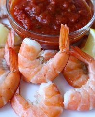 Shrimp cocktail using jumbo shrimp with tails on and boiled briefly to perfect doneness
