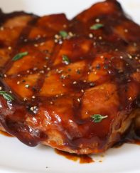A delicious grilled bone in pork chop cooked to perfection, as an example of how long to grill pork chops