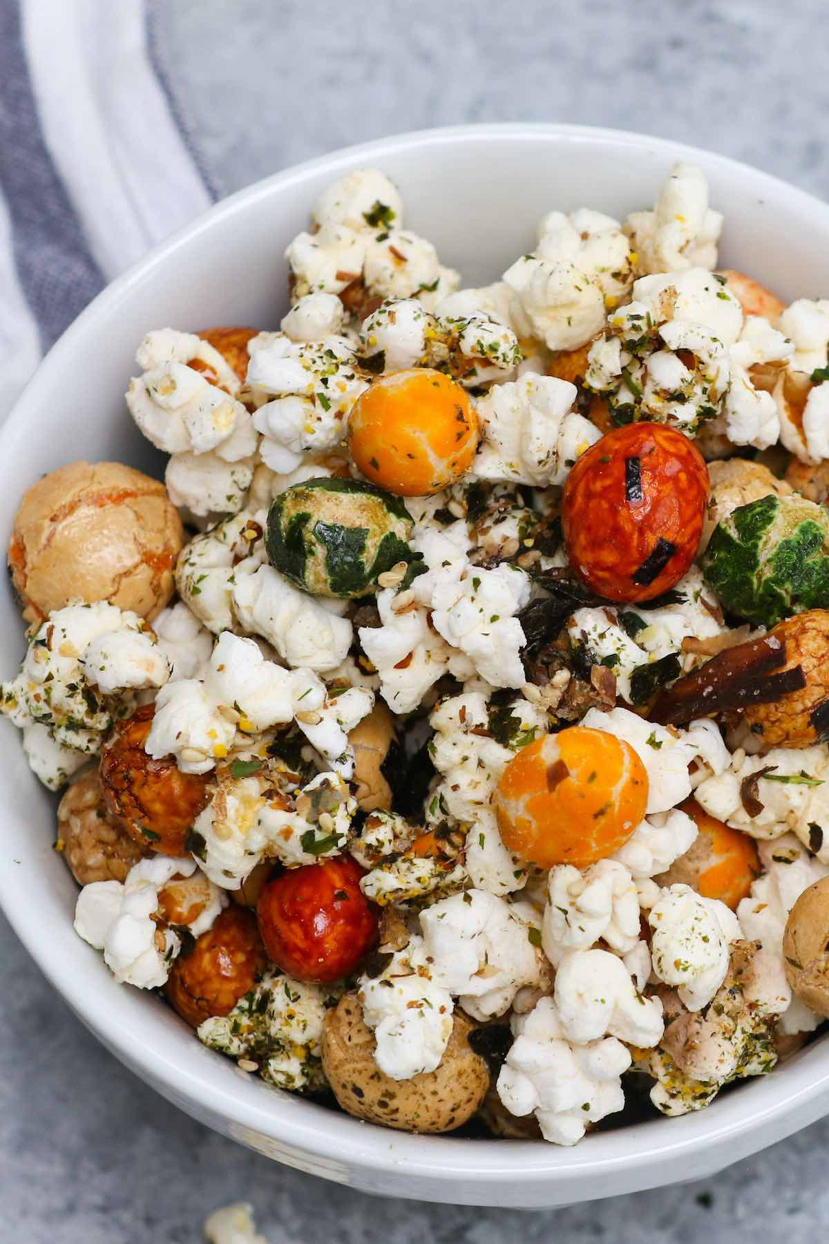 Are you looking for the perfect at-home movie snack? Look no further than Hawaiian Hurricane Popcorn. This easy treat is crunchy and buttery, with a bit of sweetness. Made with popcorn kernels, Japanese rice crackers, and furikake, this easy stove-top recipe is so much better than microwave popcorn and it takes less than 10 minutes to make! #HurricanePopcorn #HawaiianHurricanePopcorn
