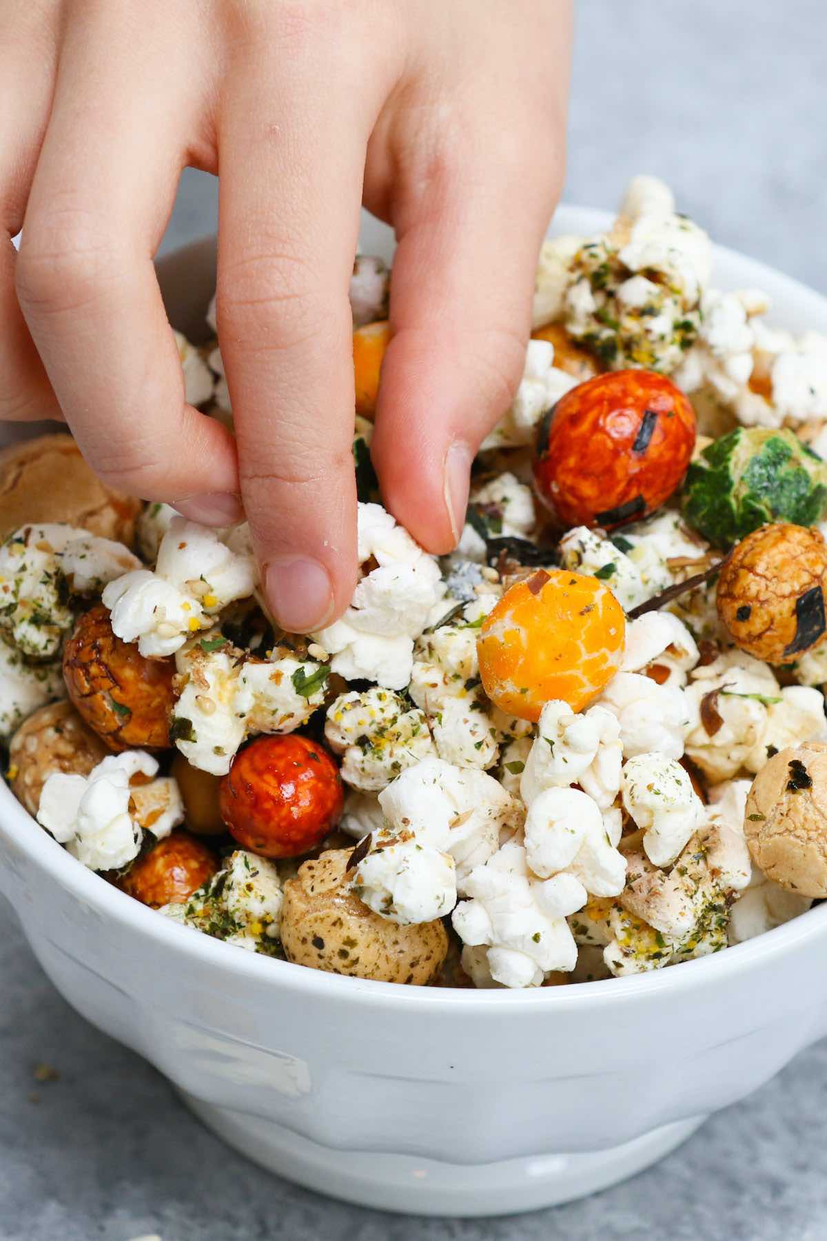 A colorful serving bowl full of Hawaiian popcorn #HurricanePopcorn #HawaiianHurricanePopcorn