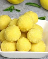 Super Easy Lemon Truffles – these flavorful lemon cake batter truffles are so easy to make and they look absolutely beautiful! It takes only 15 minutes. All you need is only 5 simple ingredients: lemon cake mix, butter, sugar, lemon and yellow sprinkles. Quick and easy recipe. Dessert, party recipe. Vegetarian. Video recipe. | Tipbuzz.com
