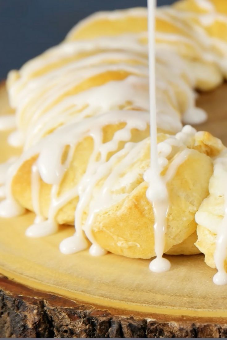 Drizzling icing onto crescent rolls