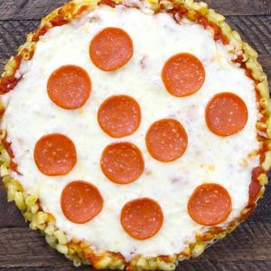 Overhead view of homemade Mac and cheese pizza with pepperoni