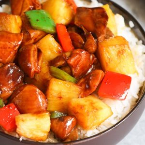 Pineapple Chicken served on a bed of steamed rice in a bowl
