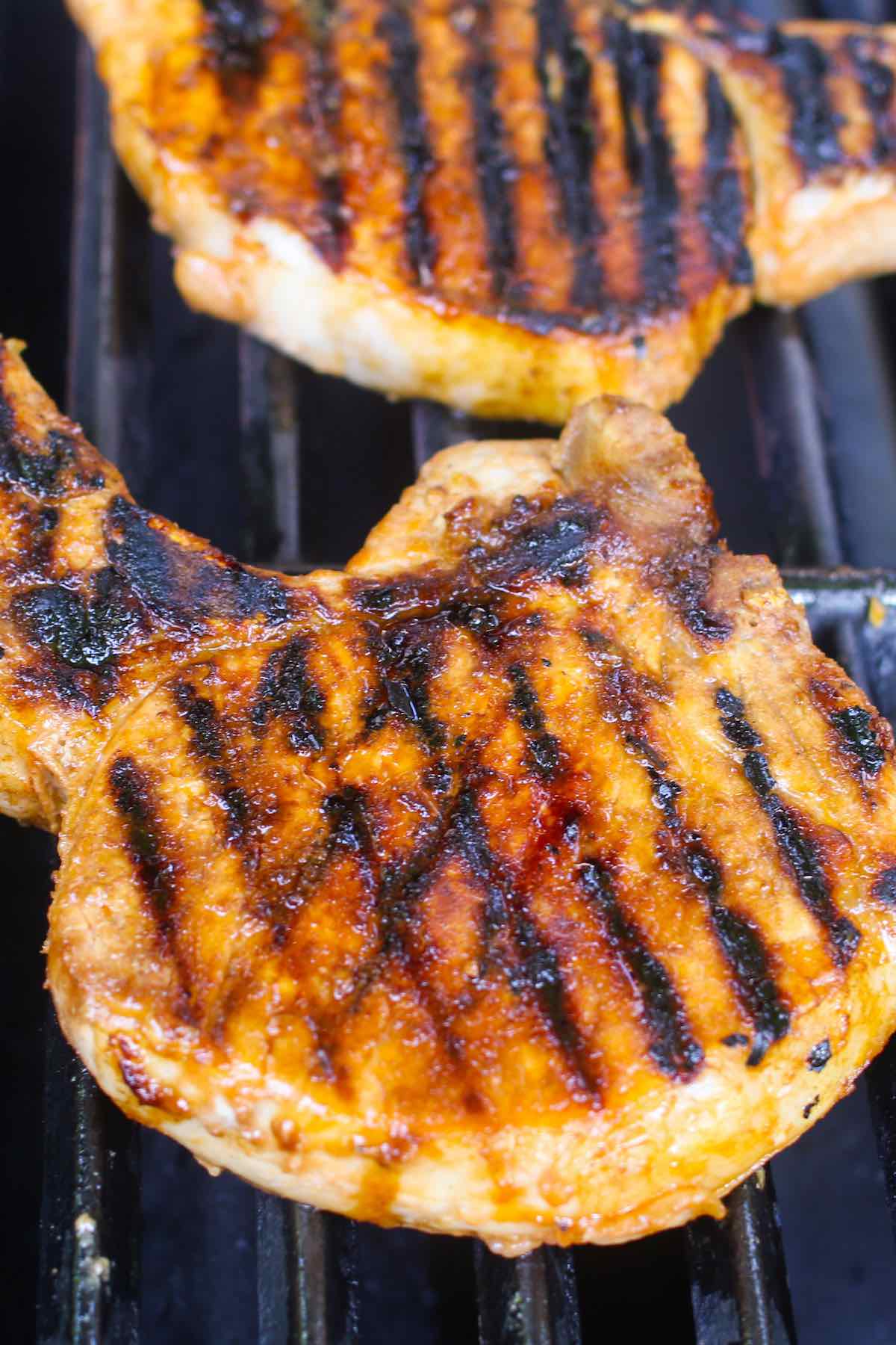 Marinated pork chops on the grill.