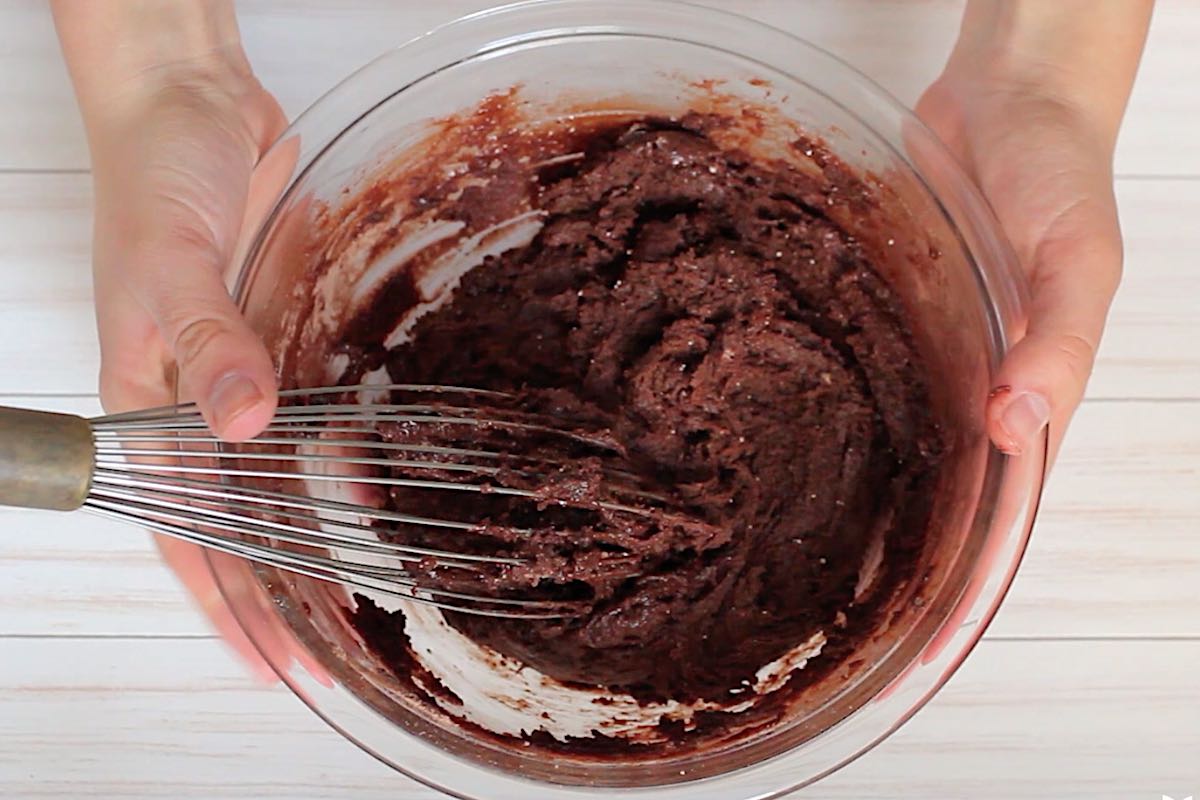 Mix together cake mix, eggs and oil in a clear mixing bowl.