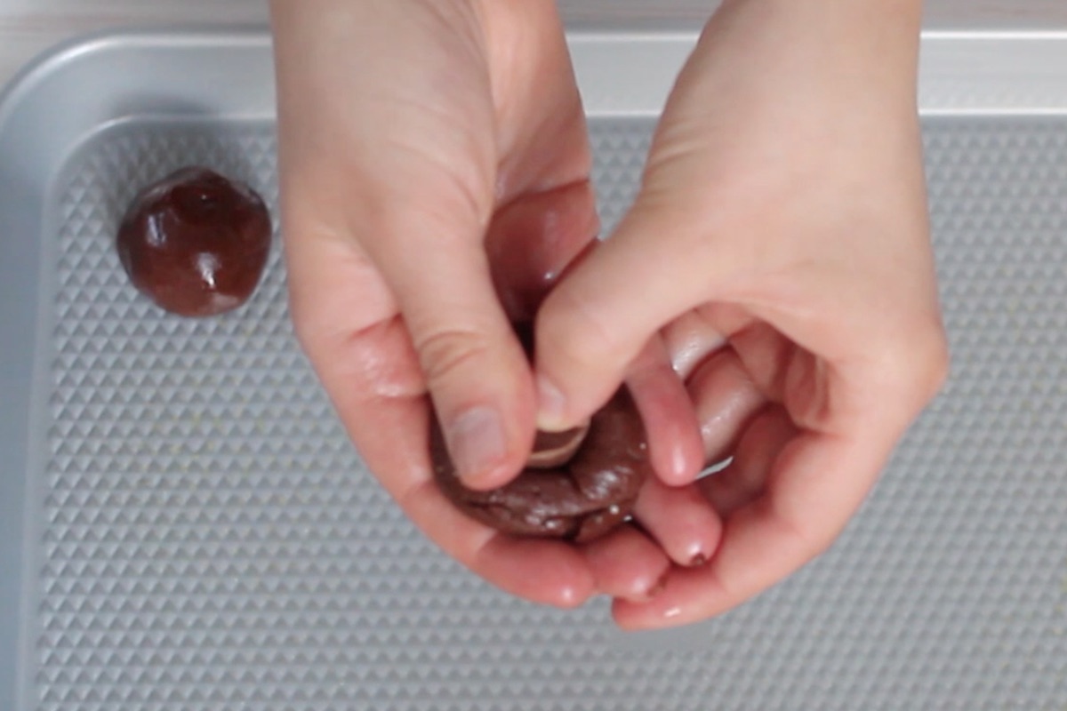 Stuff a rolo candy inside of cookie dough ball.