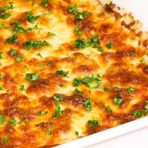 Scalloped Potatoes and Ham loaded with tender potatoes, layered with ham and cheese and smothered in a rich and creamy sauce. The best way to achieve soft and creamy potatoes is by par-boiling the potatoes first before baking. This is the best scalloped potatoes recipe ever!