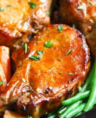 Closeup of Slow Cooker Pork Chops made with bone in rib chops and a delicious gravy