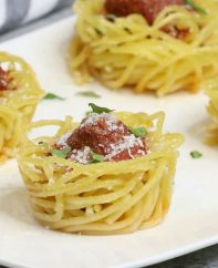Baked spaghetti and meatball cups are a fabulous party appetizer that's bursting with delicious flavors
