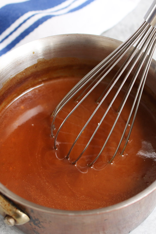 Cooking steak sauce in a medium-sized saucepan