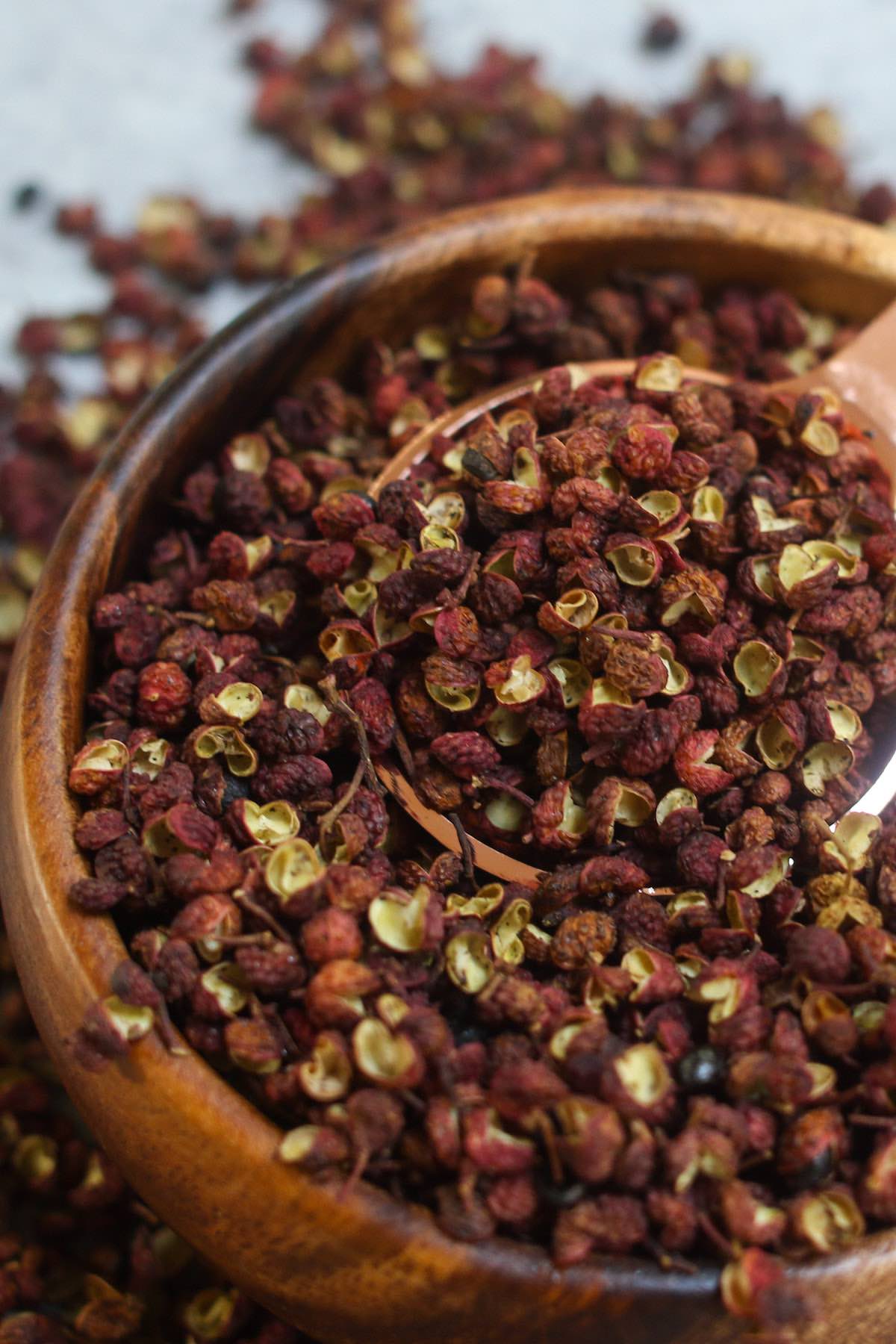 Szechuan Peppercorn is a fragrant but mouth-numbing Chinese spice that’s used in many Szechuan dishes such as Szechuan Chicken and Dan Dan Noodles. Learn how to use, store, substitute it, and more!