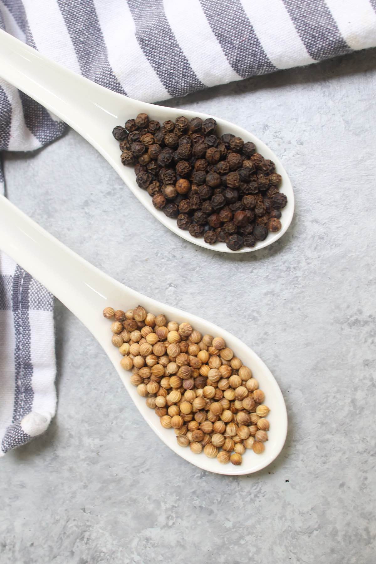 Regular black peppercorn and coriander seeds.