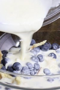 Blueberry Cheesecake Bread Pudding Pull Aparts – Soft and fluffy dinner rolls or Hawaiian sweet rolls filled with delectable blueberry cheesecake. The easiest and best bread pudding that can be pulled apart! Only 7 simple ingredients needed for this delicious treat: Dinner rolls, blueberry, cream cheese, sugar, egg, vanilla extract and milk. Serve warm out of the oven for breakfast, brunch or dessert. So good! Quick and easy, party food, party dessert. Great for Mother’s Day Brunch. Video recipe. | Tipbuzz.com